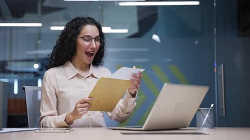 Excited Woman Receives Good News at the Office