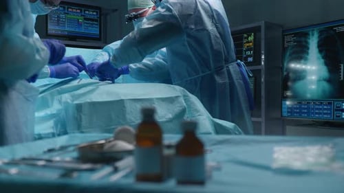 Team of Professional Medical Surgeons Performs the Surgical Operation in a Modern Hospital Doctors