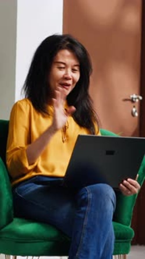 Vertical Video Hotel Client Waving on Videocall Connection with Friends