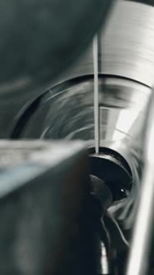 Precision lathe machine in action at metal workshop