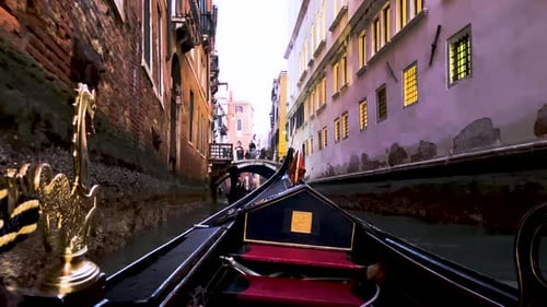 View While Riding A Gondola At The Calm Grand Canal In Venice, Italy At Daytime - wide pov shot