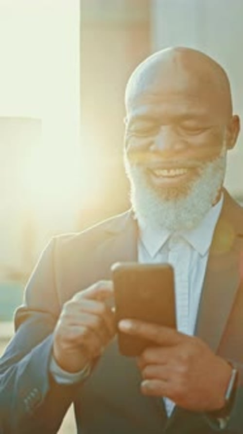 Reading, businessman and happy with phone or walking outdoor in city or news in morning sunshine