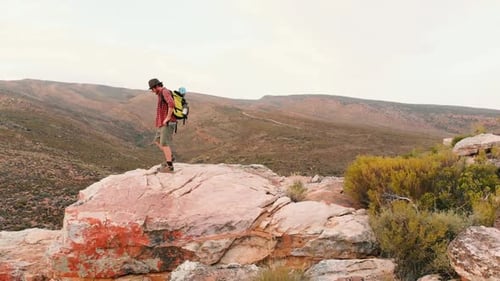 Young Caucasian man explores rugged outdoor terrain with copy space