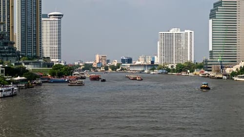 Scenic View of Chao Phraya River in Bangkok with Modern Skyscrapers