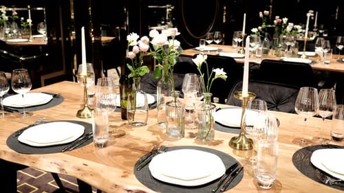 Elegantly made empty dinner tables in a chic restaurant shot with a slider