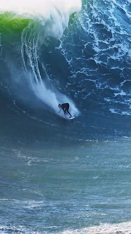 Surfer is Riding Big Wave He is Accompanied By a Jet Ski Nearby Extremal Big Wave Surfing Nazare