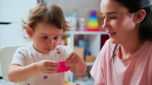 Mother and Toddler Doing Arts and Crafts Indoors