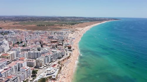 Vibrant Seaside Panorama Lively Coast Skyline with Shimmering Waters Brightly Lit Waterfront City