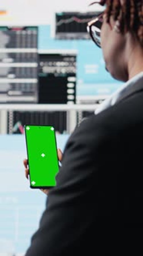 Vertical Video Business Professional Using Isolated Screen Smartphone App to Analyze Metrics
