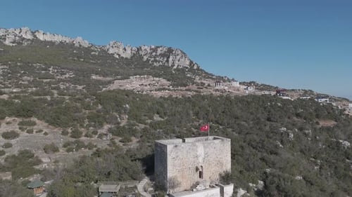 The flag on top of the castle building on the mountaintop, Belenkeşlik Castle, Turkey