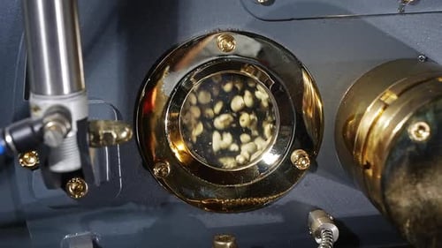 Raw Coffee Beans being Roasted in the Machine