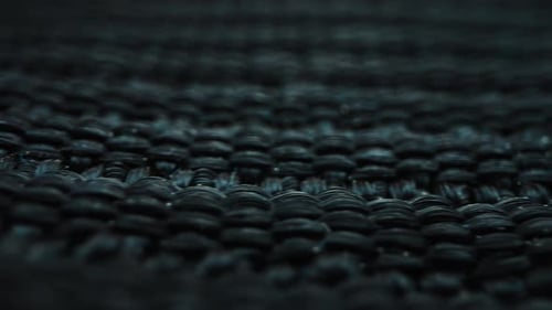 Detailed View of a Dark Textured Woven Surface