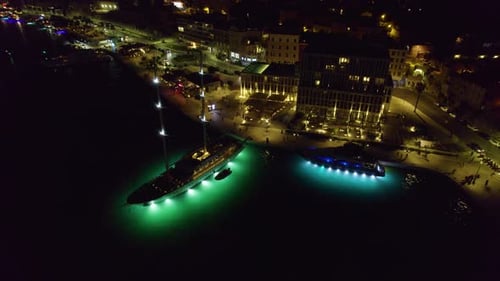Night aerial drone shot of Spilt port in Croatia with lights coming from yachts