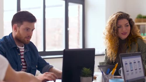 Business Colleagues in Modern Office Talking and Working