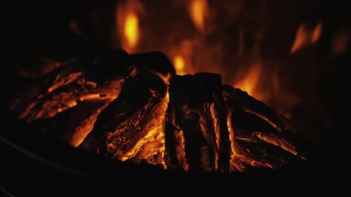 Simulated Fire Flames Flickering in Dark Fireplace