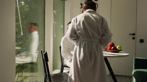 Couple Enjoying Morning Tea and Fruit at Home