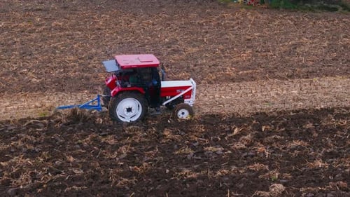 Farm Tractor Plowing Field 4k