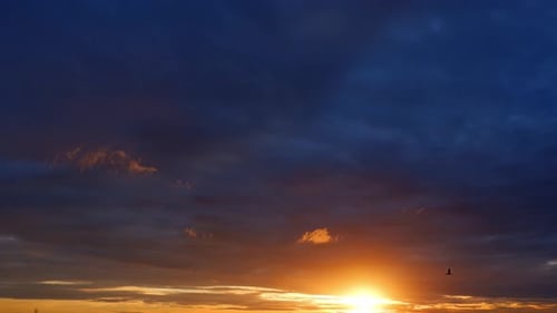 Beautiful sunset sky with clouds in Time-lapse video. 4K.