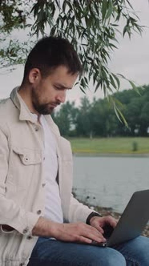 Freelancer working at the river
