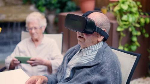 Senior People of a Nursing Home Using Technology Outdoors