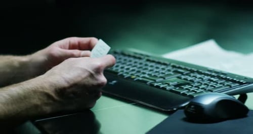 A hand writes a computer keyboard in slow motion. Concept: Technology, keyboards, businessman, imm