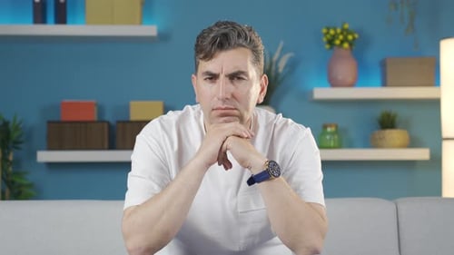Man With Gray Hair Looks Intently at Camera