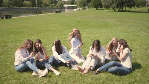 Engaging Teamwork Among Diverse Professionals in a Sunny Park Setting With a Vibrant Atmosphere and