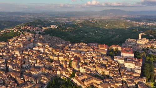 Establishing Aerial View of Perugia City Skyline at Sunset Golden Hour Italy
