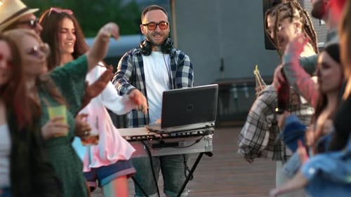 Energetic Young Adults Dancing at Urban Party