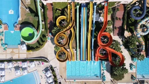 Stunning Drone View of a Massive Water Park Filled with Colorful Slides Pools Splash Zones and