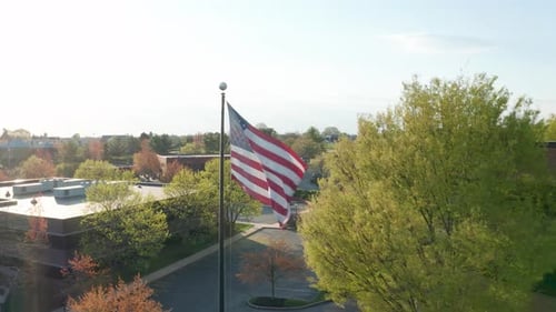 American Flag Waving Proudly Over Urban Community