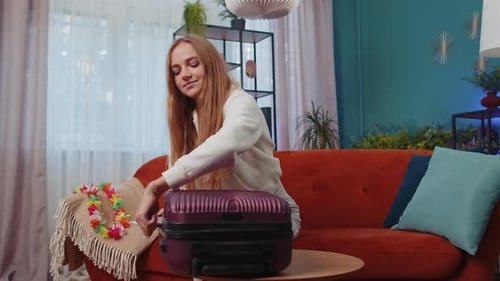 Happy Young Woman Tourist Packing Suitcase Luggage Preparation for Vacation Trip Journey at Sea