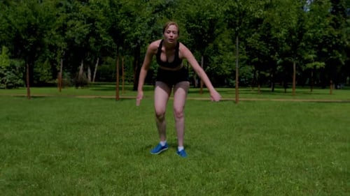 Active Sporty Fit Middle Aged Woman Doing Skater Lunges Exercise in Park