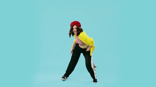 Happy Plump Young Woman in Trendy Clothing Dancing