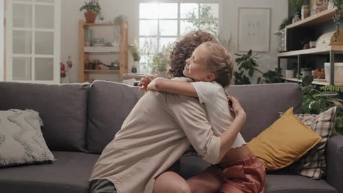Loving Mother and Child Embrace in Living Room