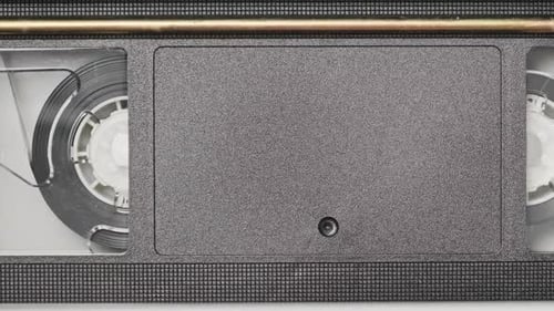 VHS Cassette is Played Inside a VCR Tape Recorder Top View