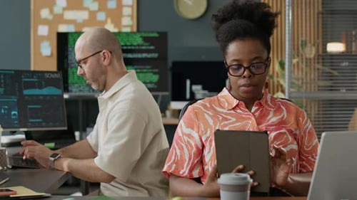 Multiethnic Software Developers Working in Open Space Office