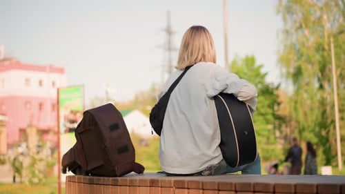 Urban Artist Plays Guitar Outside Guitarist with Blonde Hair Performs Lively Street Concert Brightly