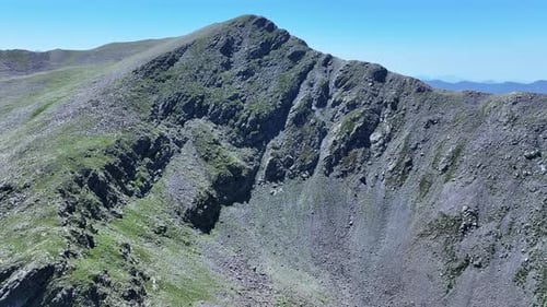 A mountain peak in Mercantour National Park seen from a drone