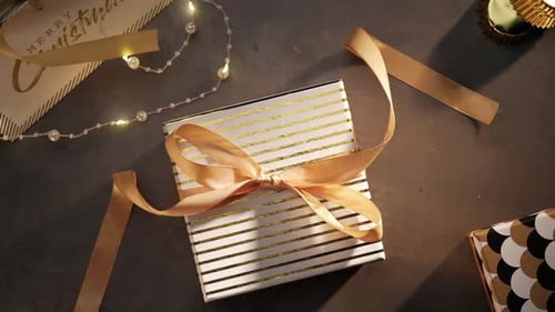 Festive Gift Box with Gold Ribbon Decoration
