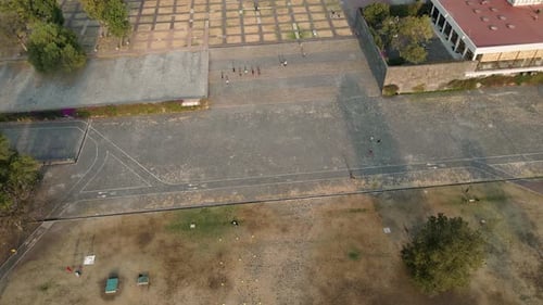Static aerial view of a University City courtyard in the early morning.