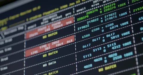 Computer screen shows all kinds of data and numbers, no batch, pan left