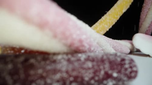 Colorful Variety of Candy Pieces Falling in Pile