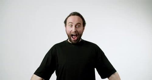 Excited Man Screaming With Joy on White Background