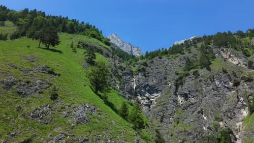waterfall in the mountains in wild nature