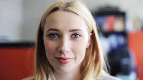 Close Up of Smiling Blonde Woman Indoors