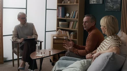 Mature Female Counselor Helping Middle-Aged Couple Overcome Marriage Crisis