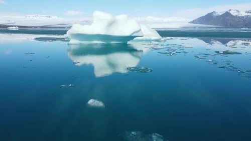 Iceberg From Melting Glacier in Iceland Ancient Blue Ice Floating in Ocean Water Pure Turquoise