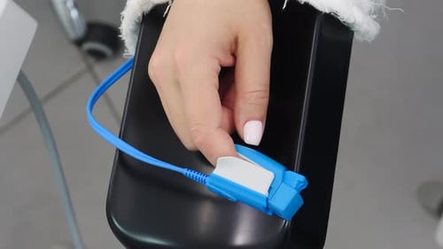 Hand with a Pulse Oximeter Medical Device