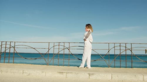 Young Woman Dancing Gracefully by the Sea